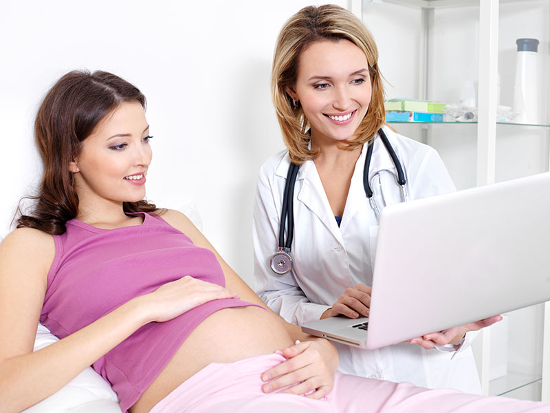 Pregnant woman getting ultrasound